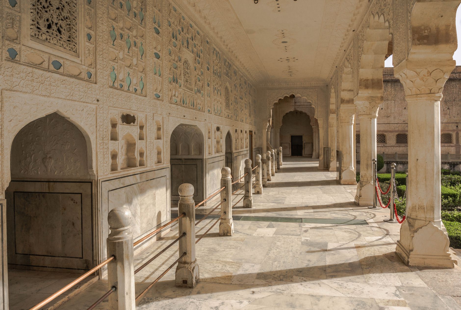 A palace corridor with traditional arches